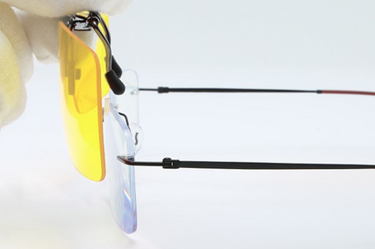 Placing Clip On Light Sensitivity Glasses On Frame